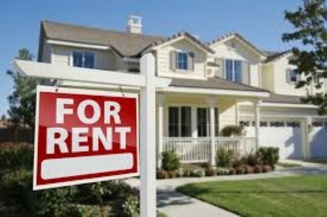 Couple evaluating rental property features like location, price, and amenities before renting a home